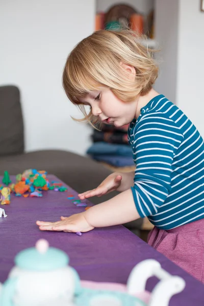 Little child playing with plasticine — Stock Photo, Image