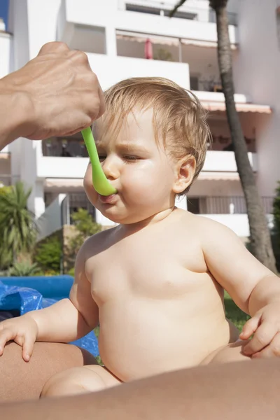 Baby eating on summer — Stock Photo, Image