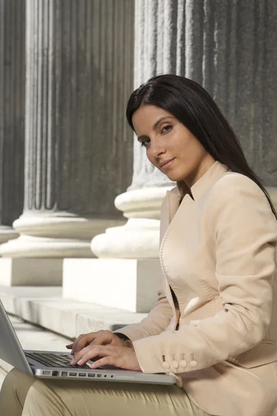 Pretty businesswoman typing laptop — Stock Photo, Image