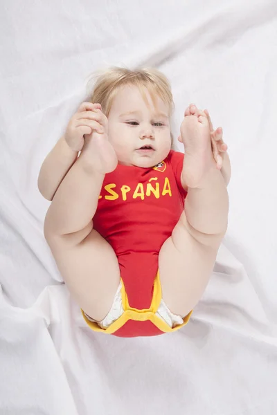 Flexibla baby spansk fotboll fan — Stockfoto