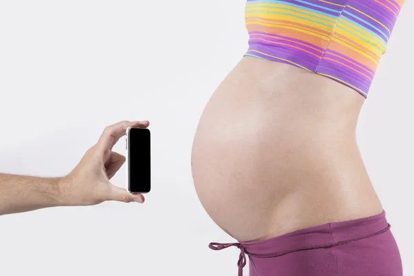 Smartphone for tummy pregnant — Stock Photo, Image