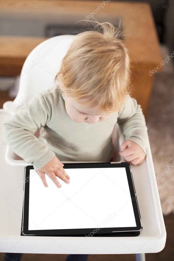 baby touching screen tablet