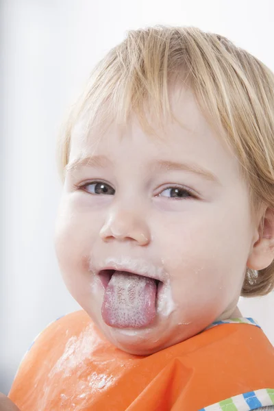 Sticking out tongue eating — Stock Photo, Image