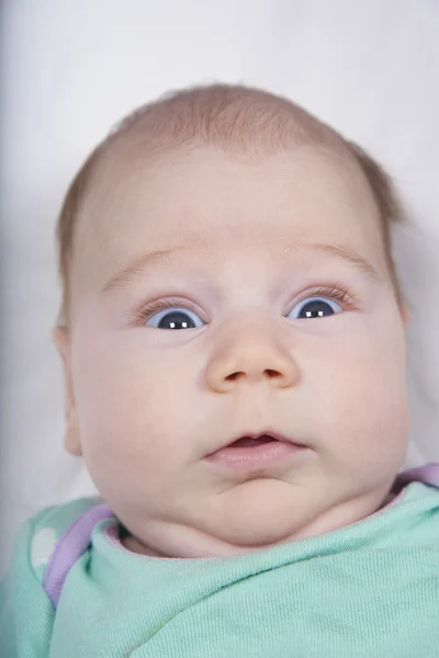 Newborn surprised face — Zdjęcie stockowe