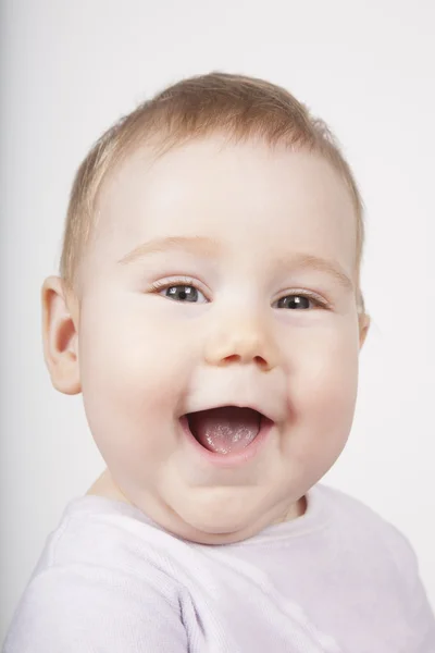 Baby gezicht lachend — Stockfoto