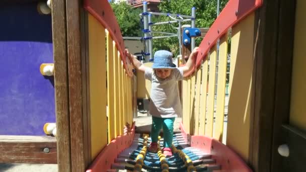 Baby walking in playground — Stock Video