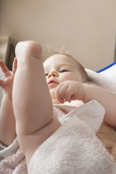 Baby lying wrapped on towel — Stock Photo, Image