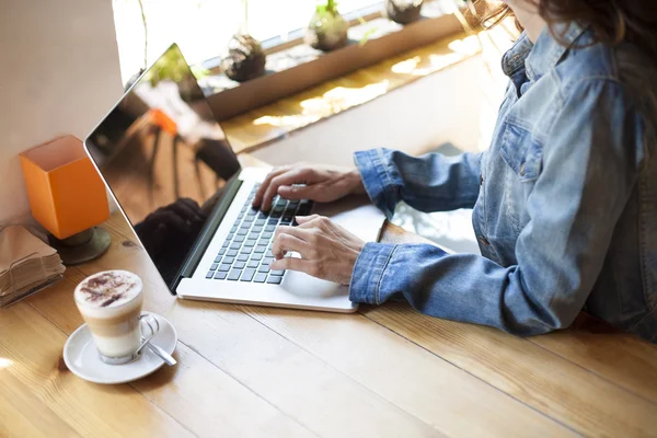 Blue jeans jacket woman typing computer — Stock Photo, Image