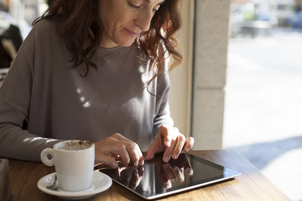 Typing tablet in cafe horizontal — Stock Photo, Image