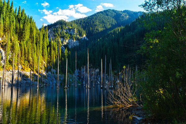 Kaindy Lake in Tien Shan mountain, Kazakhstan. Autumn