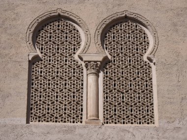 Medieval bifora window of palace in european Saragossa city at Aragon district in Spain in 2019 warm sunny summer day on September.
