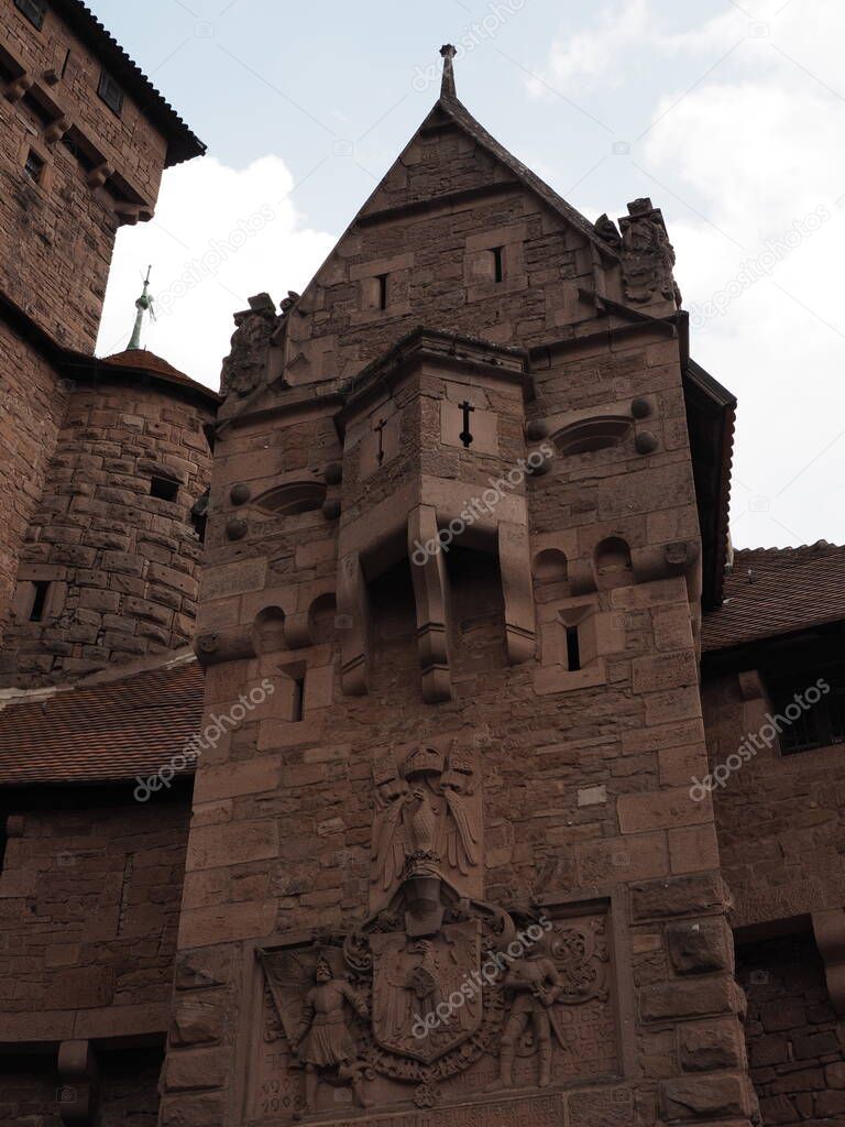 Turret of Koenigsbourg castle in european Orschwiller town of Alsace region in France with cloudy sky in 2018 warm summer day on August - vertical
