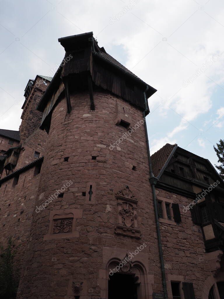 Part of Koenigsbourg castle in european Orschwiller town of Alsace region in France with cloudy sky in 2018 warm summer day on August - vertical