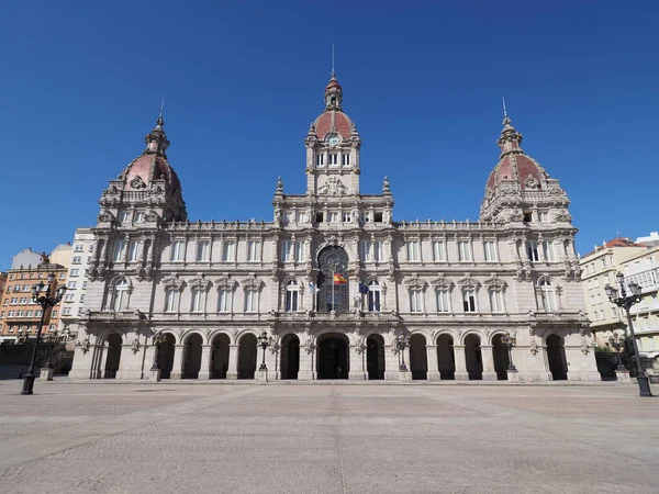 Elevation of city hall building on square in european A Coruna city at Galicia in Spain, clear blue sky in 2019 warm sunny summer day on September.