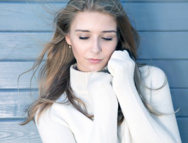 young blonde woman wearing knitted sweater clipart