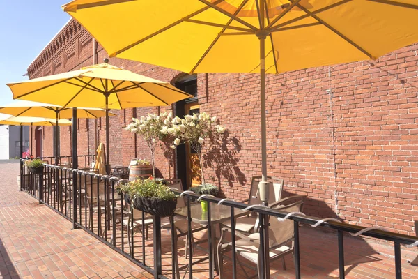 Yellow umbrellas in an outdoor caffe Wala Wala WA. — Stock Photo, Image