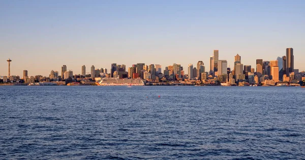 Seattle skyline architecture at sunset from across the bay Washington state.