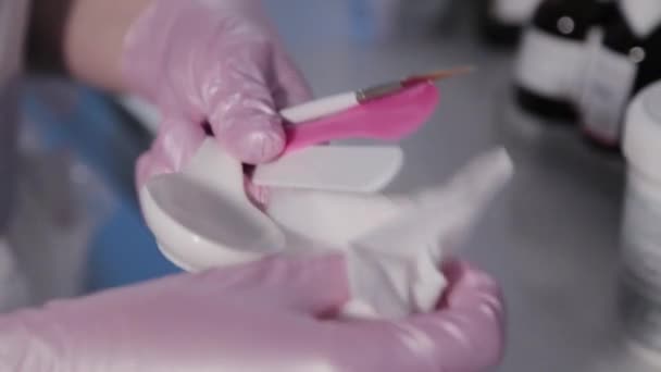 Woman beautician processes tools for cosmetic procedure. — Stock Video