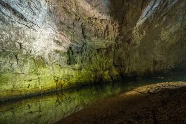 Underground river in Planina Cave clipart