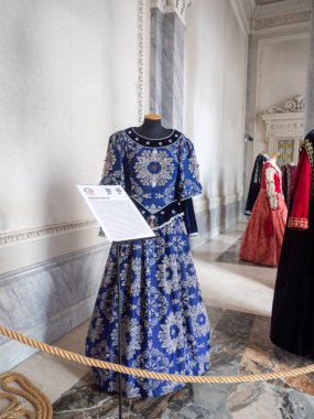 Cremona, Italy November 19th 2025 Medieval noble clothing replica from the Sforza court on a mannequin, part of a historical costume exhibition in an Italian museum