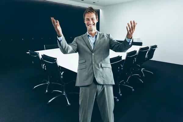Corporate man in suit in modern Boardroom Stock Photo