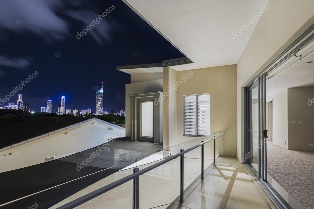 Balcony Exterior Of Mansion With Night Views Of Skyline Stock
