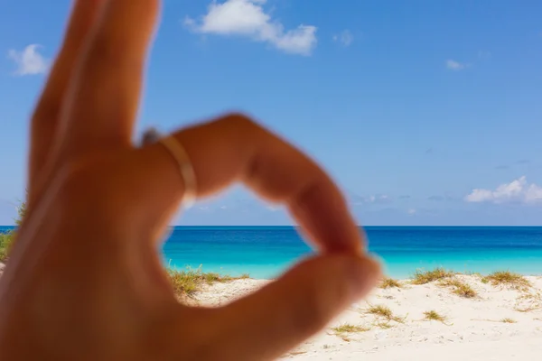 Picture of fingers with background of the beach — Stock Photo, Image