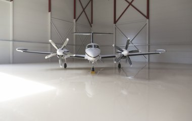 Small aircraft parked in a hangar