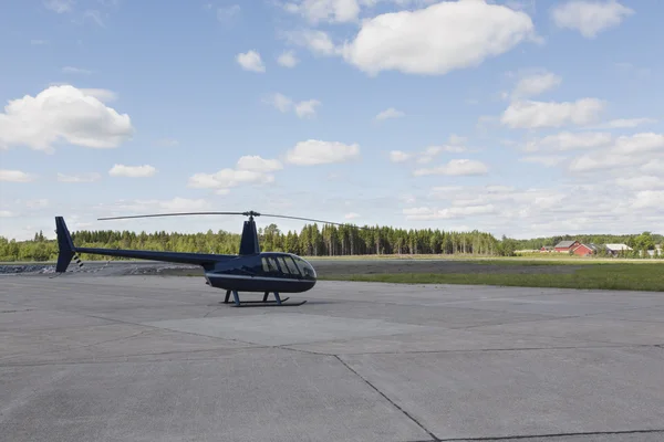 Helicopter parked in a small airport — Stock Photo, Image