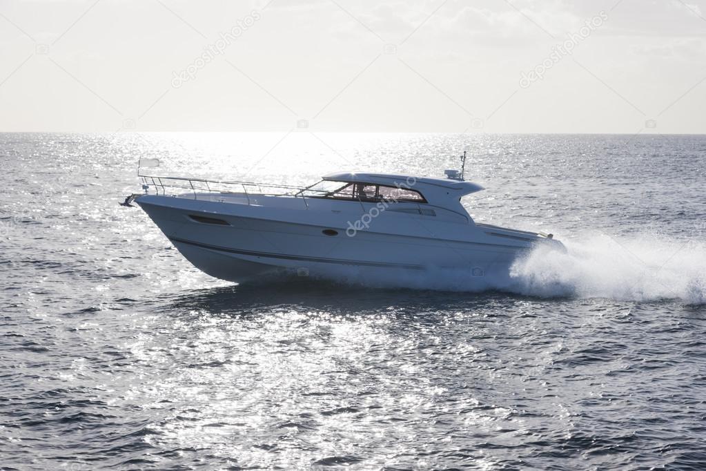 Luxurious yacht in bright backlit sunlight