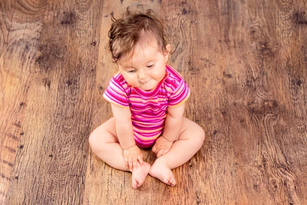 Baby sitting on floor — Stock Photo, Image