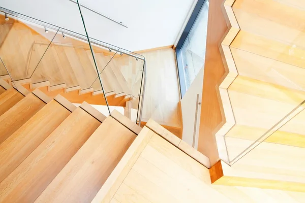 Modern architecture interior with wooden stairs — Stock Photo, Image