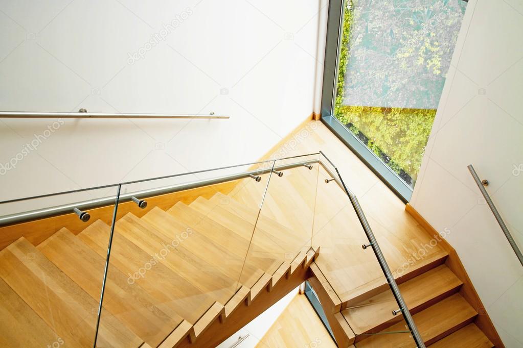 Modern interior with wooden stairs