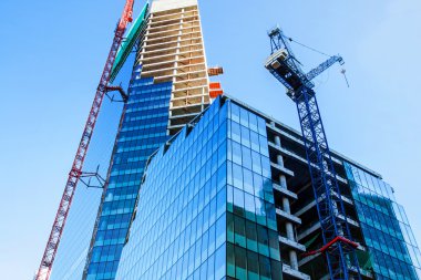 Modern office tower building construction clipart