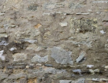 Kırsal gri ve bej kireç taşı duvar arkaplan olarak uygun.