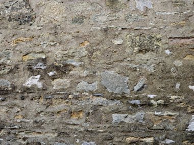 Kırsal gri ve bej kireç taşı duvar, kaba bir metin kağıdı kadar uygun.