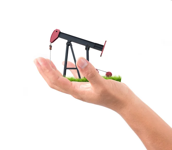 Hand hold pumpjack — Stockfoto