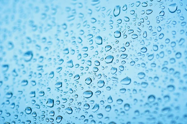 Gotas Lluvia Cristal Ventana Dof Poco Profundo Fondo Agua Azul —  Fotos de Stock