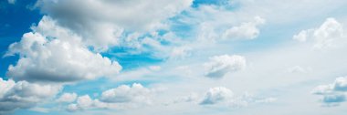 Panoramic Blue Sky with light fluffy clouds banner background. Wide Angle Natural Wallpaper With Copy Space. Texture for Design. Amazing Eco-friendly cloudscape clipart