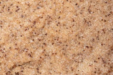 Kahve fırçası arka planı. Yüz ve vücut için doku kozmetik jel fırçası. Seçici odaklanma. Üst görünüm, boşluğu kopyala. Vücut bakımı güzellik merkezi konsepti. Deri yüzen parçacıklarla vücut fırçası.