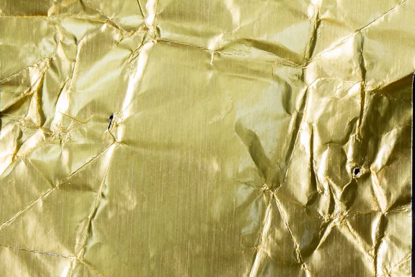 Folha dourada texturizada e fundo — Fotografia de Stock