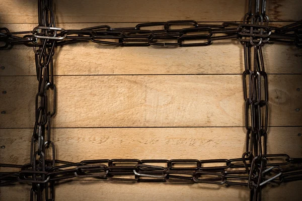 Łańcuch ramki na podłoże drewniane — Zdjęcie stockowe