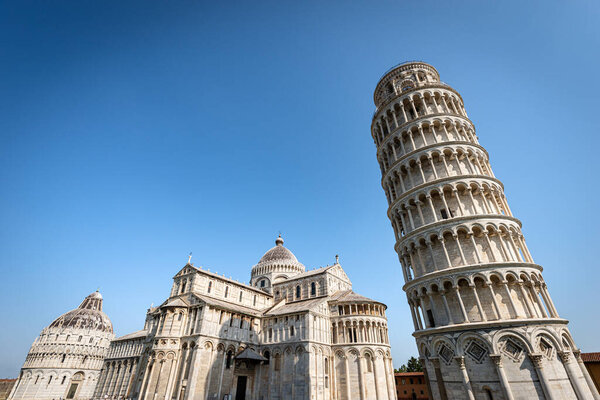 Pisa, Piazza dei Miracoli (Square of Miracles), Leaning Tower, the Cathedral (Duomo of Santa Maria Assunta) and the Baptistery (Battistero di San Giovanni). UNESCO heritage site, Tuscany, Italy.