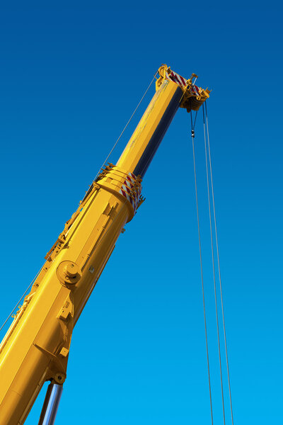 Heavy Hydraulic Crane on Blue Sky