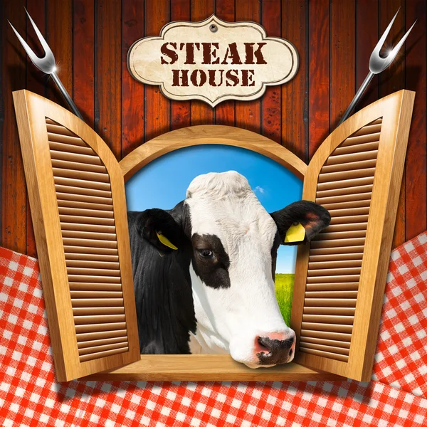 Steak house - okno s krávou — Stock fotografie