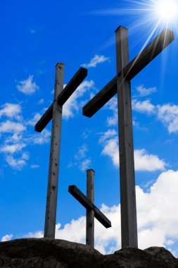 Golgotha - Three Crosses on Blue Sky clipart