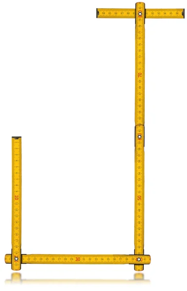 Шрифт J - Старий жовтий метр лінійки — стокове фото