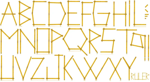Krój pisma - stary żółty miernik władca — Zdjęcie stockowe