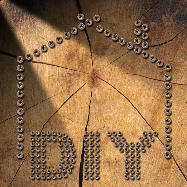 Diy のシンボル - 木製の背景のネジ — ストック写真