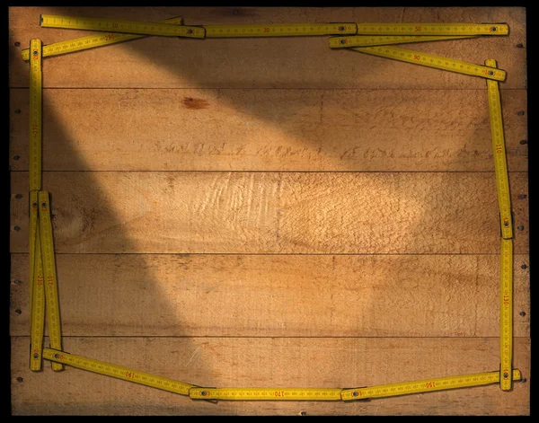 Holzhintergrund mit Linealrahmen — Stockfoto